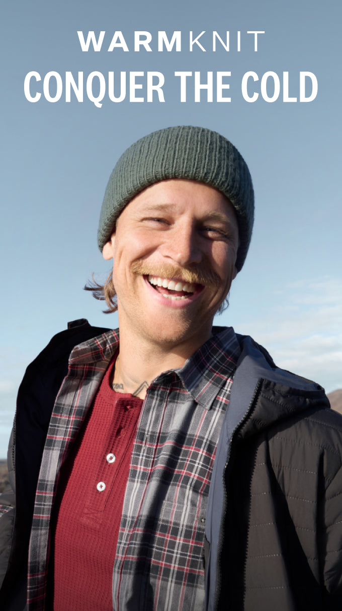 Man wearing WARMKNIT Flannel Shirt and WARMKNIT AIR Hooded Jacket